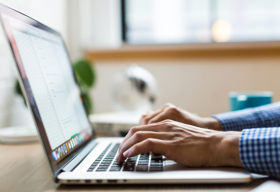 Person typing on a computer